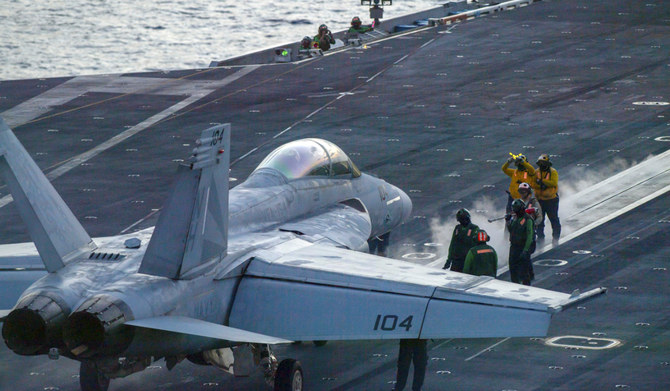In this photograph released by the U.S. Navy, an F/A-18 Super Hornet prepares to launch off the flight deck of the Nimitz-class aircraft carrier USS Theodore Roosevelt July 5, 2024, in the South China Sea. (AP)