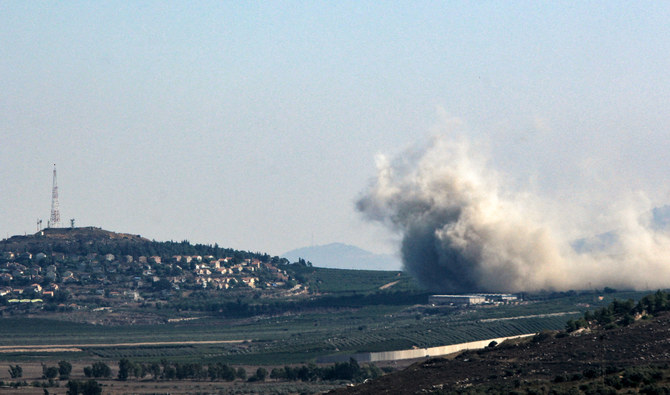 Smoke billows from the site of an Israeli strike that targeted the outskirts of the southern Lebanese village of Kfar Kila, facing the Israel village of Metullah (L) on August 7, 2024. (AFP)