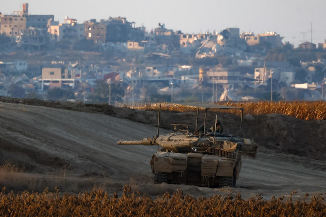 An Israeli tank holds its position near the Israel-Gaza border, amid the ongoing conflict between Israel and Hamas, in Israel. (Reuters)