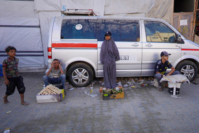 Children sell goods on a street in Khan Yunis, southern Gaza Strip, on August 15, 2024, amid the ongoing conflict between Israel and the Palestinian militant group Hamas. (AFP)