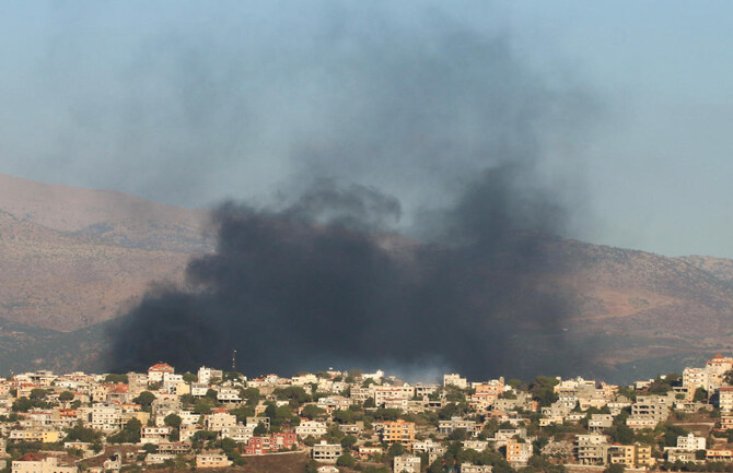 Smoke rises near buildings in Khiam, amid cross-border hostilities between Hezbollah and Israeli forces, as pictured from Marjayoun, near the border with Israel, Lebanon August 23. (Reuters)