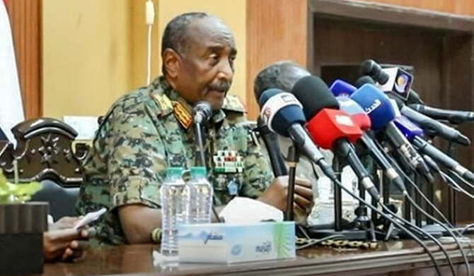 This handout image posted on the Sudanese Armed Forces's facebook page on August 24, 2024, shows army chief General Abdel Fattah al-Burhan giving a press conference in Port Sudan, in the Red Sea state. (AFP)