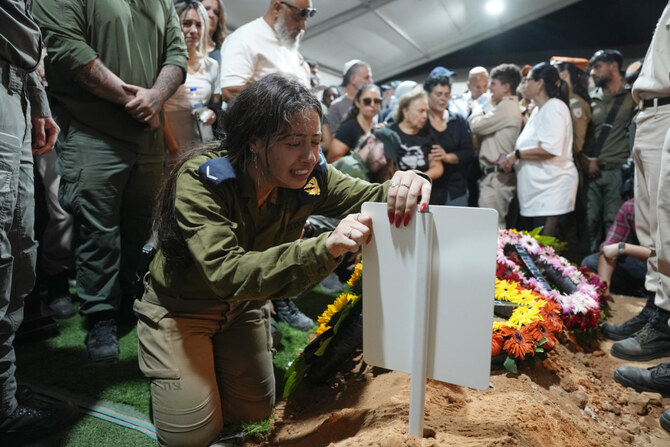 The sister of Petty Officer 1st Class David Moshe Ben Shitrit, who was killed on a Hezbollah attack, mourns during his funeral at the Mount Herzl military cemetery in Jerusalem on Aug. 25, 2024. (AP)