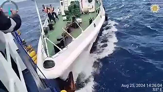 This frame grab from handout video footage taken and released on August 25, 2024 by the Philippine Coast Guard shows a Chinese coast Guard ship (R) ramming a Philippine fisheries vessel near Sabina Shoal in the South China Sea. (AFP)
