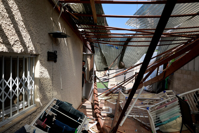 Above, a damaged residential building after Hezbollah launched hundreds of rockets and drones towards Israel in Acre, northern Israel on Aug. 25, 2024. (Reuters)