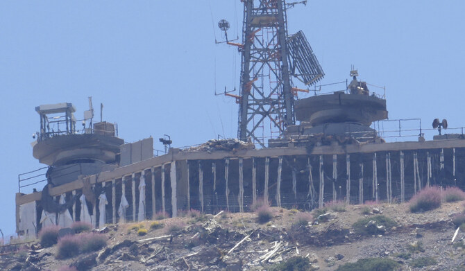 A damaged Israeli military position targeted by Hezbollah fighters is seen on the top of Mount Hermon in the Israeli-controlled Golan Heights. (AP)