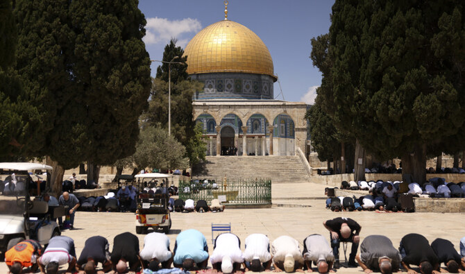 People perform the Friday noon prayer in front of the Dome of the Rock mosque in Old Jerusalem's al-Aqsa mosque compound on August 2, 2024. (AFP)