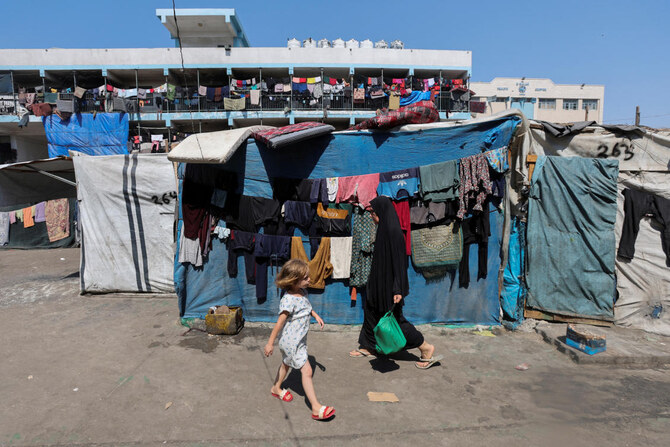 Displaced Palestinians shelter in a United Nations-run school, amid the Israel-Hamas conflict, in Deir Al-Balah, central Gaza Strip, Aug. 27, 2024. (Reuters)