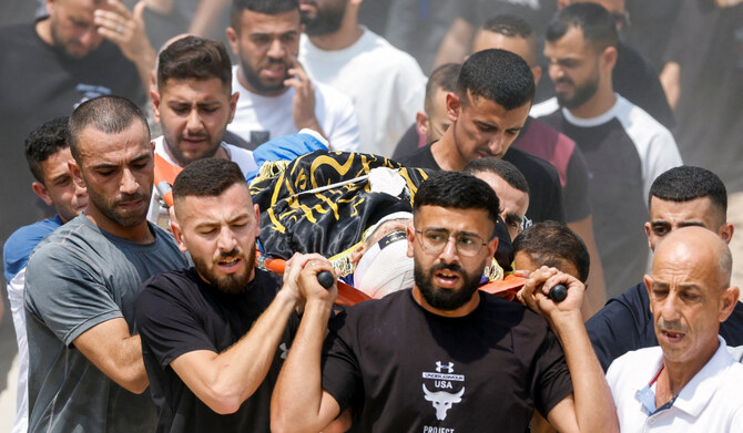 Mourners carry the body of a Palestinians who was killed in an Israeli air strike, during their funeral in Nur Shams near Tulkarm in the Israeli-occupied West Bank August 27,2024. (REUTERS)