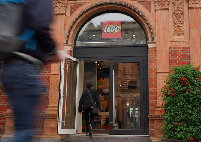 People pass a Lego store in Copenhagen, Denmark August 29, 2023. (Reuters)