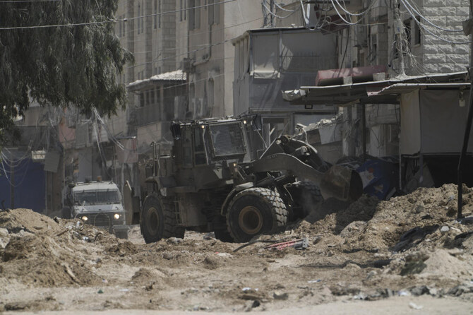 A bulldozer from the Israeli forces moves on a street during a military operation in the West Bank refugee camp of Nur Shams, Tulkarem, Thursday, Aug. 29, 2024. (AP)