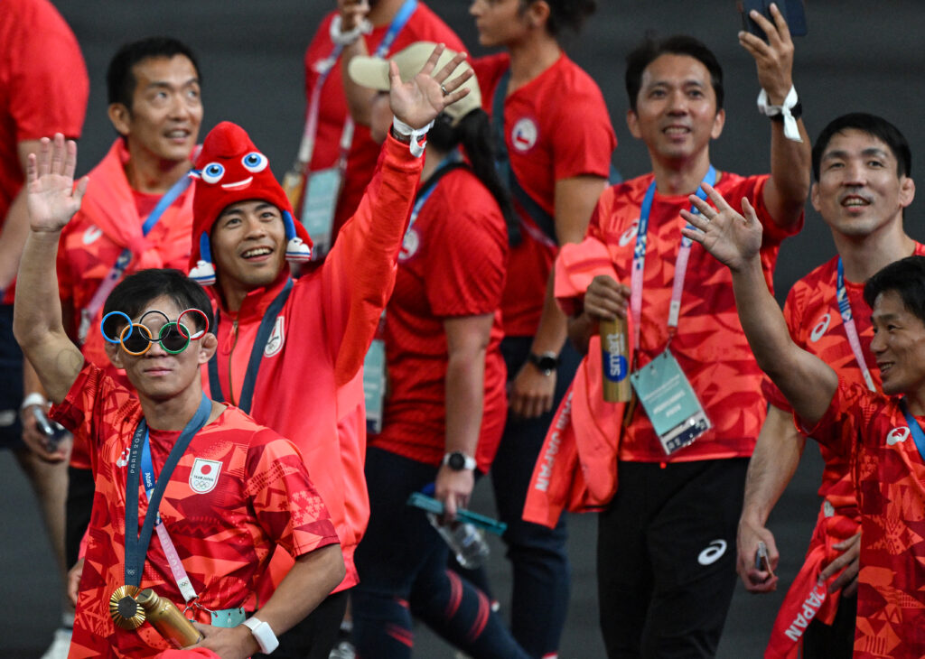 Japan's athletes take part in the athletes parade during the closing ceremony of the Paris 2024 Olympic Games at the Stade de France, in Saint-Denis, in the outskirts of Paris, on August 11, 2024. (AFP)