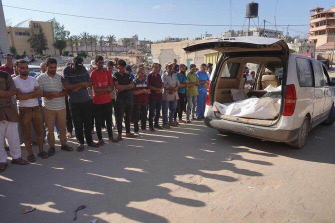 Palestinians attend the funeral of members of the Najjar family, killed in an Israeli strike, in Khan Yunis in the southern Gaza Strip on August 12, 2024. (AFP)