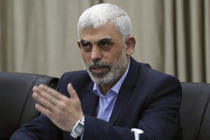 Yahya Sinwar, head of Hamas in Gaza, greets his supporters during a meeting with leaders of Palestinian factions at his office in Gaza City, on Apr. 13, 2022. (AP)
