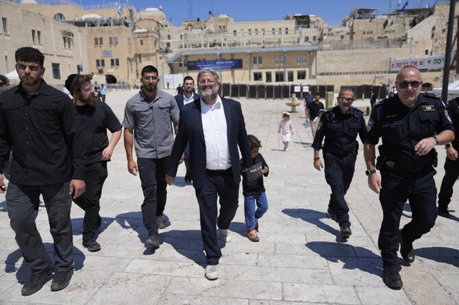 Israel’s far-right National Security Minister Itamar Ben-Gvir (C) approaches the entrance to Jerusalem’s most sensitive holy site in the Old City, Tuesday, Aug. 13, 2024. (AP)