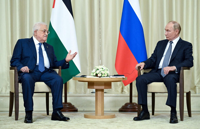 Russian President Vladimir Putin, right, meets with Palestinian President Mahmoud Abbas outside Moscow on Aug. 13, 2024. (Sputnik via Reuters)