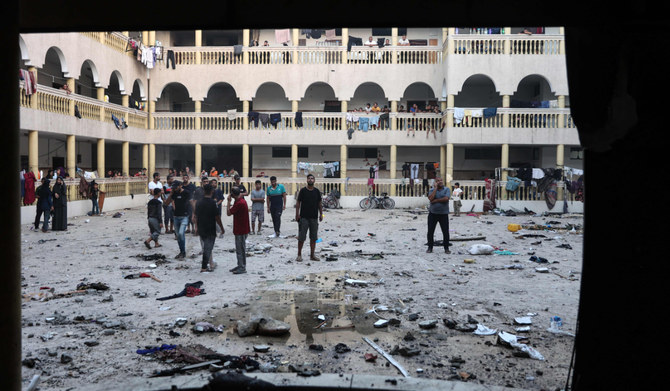 Displaced Palestinians gather in the yard of a school hit by an Israeli strike in Gaza City on August 10, 2024, that killed around 100 people. (AFP/file)