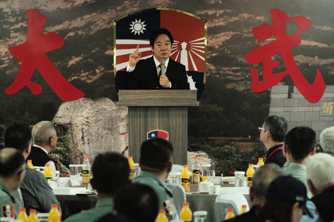 Taiwan President Lai Ching-te (C) speaks to the veterans during the 66th anniversary of the Kinmen artillery battle in Kinmen on August 23, 2024. (AFP)