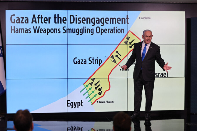 Israel's Prime Minister Benjamin Netanyahu points at a map of the Gaza Strip during a press conference in Jerusalem on Sept. 4, 2024. (POOL/AFP)