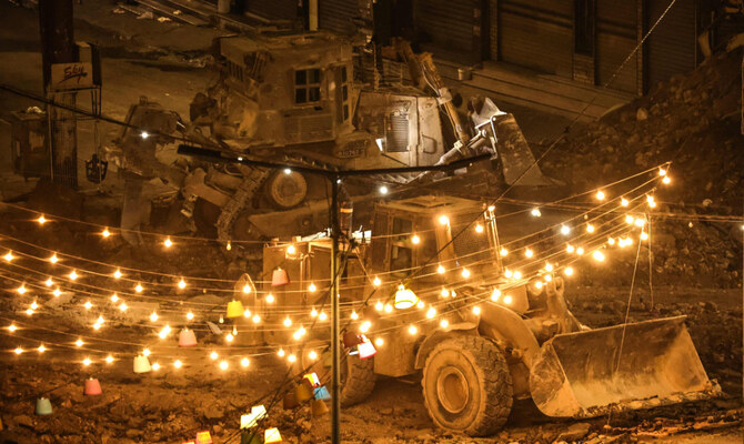 Bulldozers tear up a street during an Israeli raid in the centre of Jenin in the occupied West Bank on September 3, 2024. (AFP)