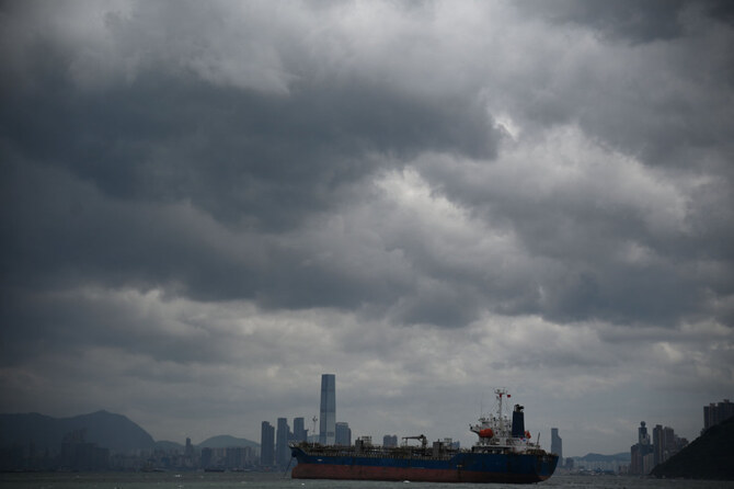 A ship passes by as storm clouds gather over Victoria harbor in Hong Kong on September 5, 2024, as super typhoon Yagi tracked across the South China Sea towards the southern China coast. (AFP)
