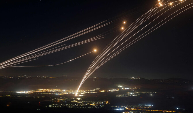 Rockets fired from southern Lebanon are intercepted by Israel's Iron Dome air defence system over the Upper Galilee region in northern Israel, on August 4, 2024, amid ongoing cross-border clashes between Israeli troops and Lebanon's Hezbollah fighters. (AFP)