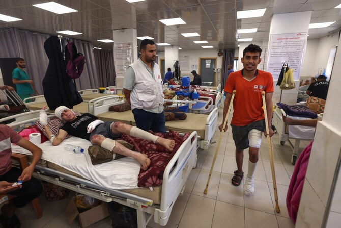 Wounded Palestinians receive treatment at a clinic set up by medical charity Doctors Without Borders treating severe injuries and burns sustained in an Israeli bombardment. (AFP)
