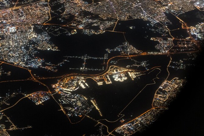 This aerial view shows Tel Aviv's Ben Gurion International Airport in the centre and the surrounding urban areas in Lod (L) in central Israel on April 5, 2024 (AFP)