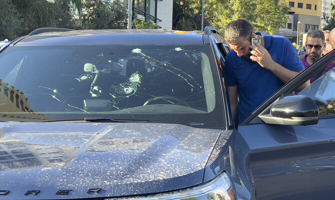 Police officers inspect a car inside of which a hand-held pager exploded, Beirut, Lebanon, Tuesday, Sept. 17, 2024. (AP)
