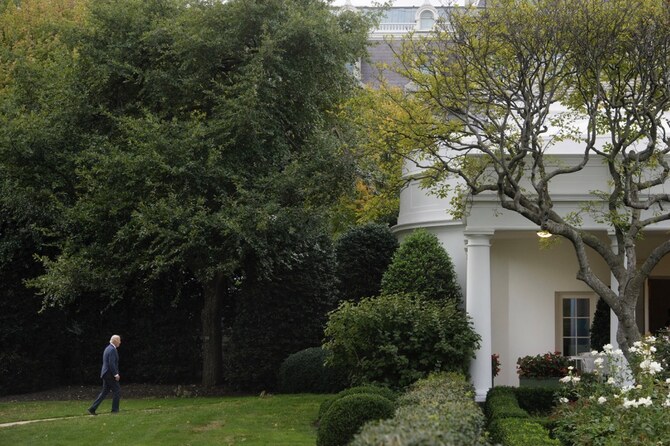 President Joe Biden walks to the Oval Office as he arrives at the White House in Washington. (AP)