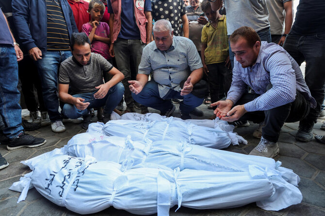 Mourners pray next to the bodies of Palestinians killed in Israeli strikes, amid the Israel-Hamas conflict, at Al-Aqsa Martyrs Hospital in Deir Al-Balah in the central Gaza Strip, Sept. 23, 2024. (Reuters)