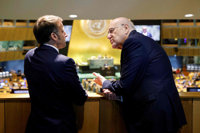 French President Emmanuel Macron (L) speaks with Prime Minister of Lebanon Najib Mikati on the sidelines of the 79th Session of the United Nations General Assembly in New York on September 25, 2024. (AFP)