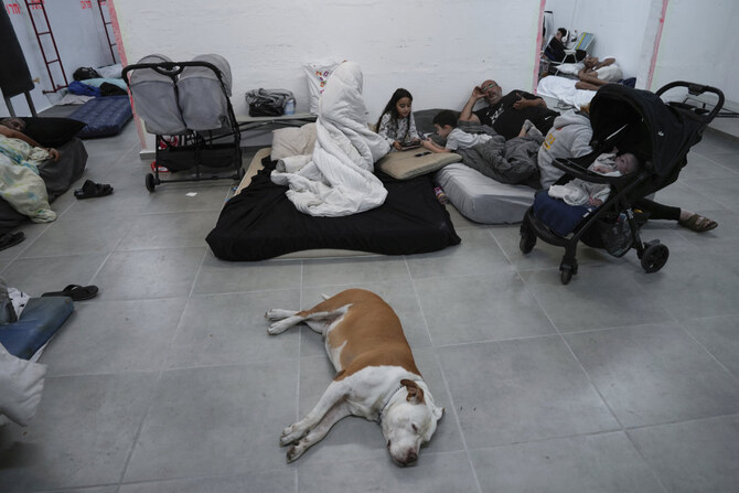 Israelis stay in a residential building bomb shelter in Kiryat Haim, northern Israel, to stay safe from rockets fired from Lebanon on Sept. 24, 2024. (AP)