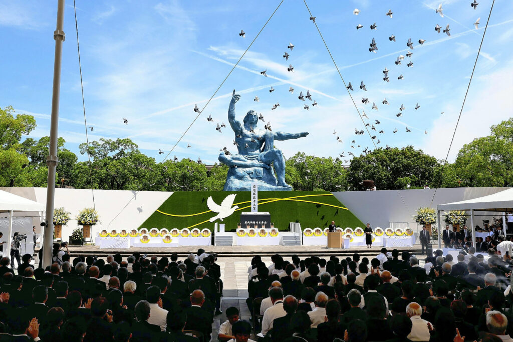 Pigeons are released during a peace prayer ceremony at the Peace Park in Nagasaki on August 9, 2024, during ceremonies to mark the 79th anniversary of the atomic bombing of the city. (AFP)
