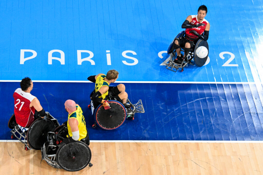 This overview shows Japan's Hitoshi Ogawa (R) in action against the Australian team during the semi-final wheelchair rugby match, during the Paris 2024 Paralympic Games at the Champ-de-Mars Arena in Paris on September 01, 2024. (AFP)