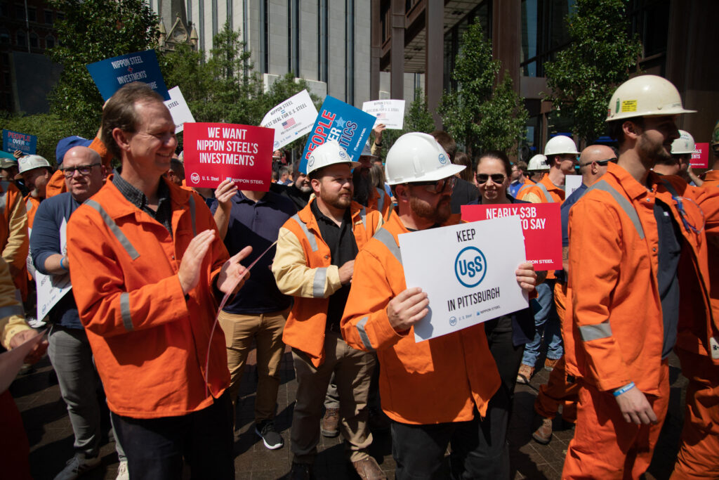 US Steel Corporation workers rally outside the company's headquarters in Pittsburgh, Pennsylvania, supporting the takeover by Japan's Nippon Steel, on September 4, 2024. (AFP)