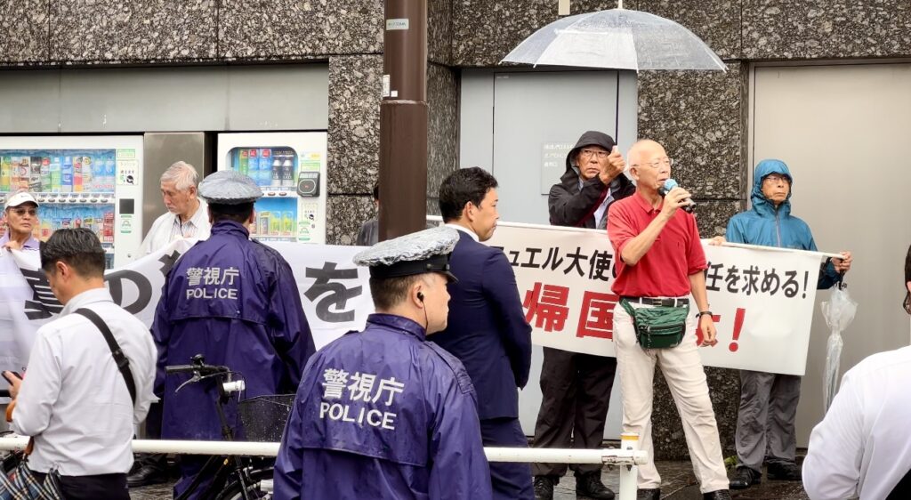 The group issued a letter that was distributed at the protest site, branding Ambassador Emanuel as being