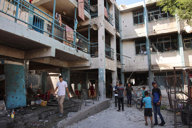 Palestinians inspect the damage at the site of an Israeli strike on a school housing displaced Palestinians in Gaza City's Zaytoun neighbourhood on September 21, 2024. Gaza's civil defence agency said an Israeli strike on a school-turned-shelter in the Palestinian territory's largest city killed 19 people, while Israel's military said it targeted Hamas militants. (AFP)