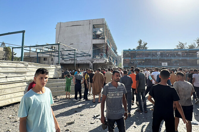 Palestinians inspect a school sheltering displaced people, after it was hit by an Israeli strike, in Nuseirat in the central Gaza Strip, on Sept. 11, 2024. (Reuters)