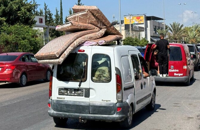 People travel in a vehicle heading north from Lebanon’s southern coastal city of Sidon as some Lebanese flee heavy Israeli bombardment, Lebanon, Sept. 23, 2024. (Reuters)