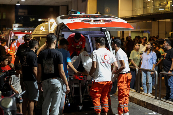 Person is carried on a stretcher outside American University of Beirut Medical Center (AUBMC) as people, including Hezbollah fighters and medics, were wounded and killed when the pagers they use to communicate exploded across Lebanon. (Reuters)