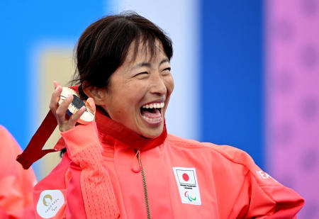 Bronze medallist Misato Michishita of Japan celebrates on the podium. (Reuters)