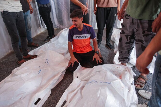 Family and friends mourn by the bodies of five members of the Alborno family at Al-Ahli Arab hospital, also known as the Baptist hospital in Gaza City on September 15, 2024 (AFP)