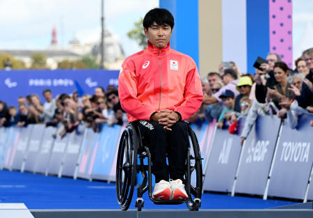 Bronze medallist Tomoki Suzuki of Japan on the podium. (Reuters)