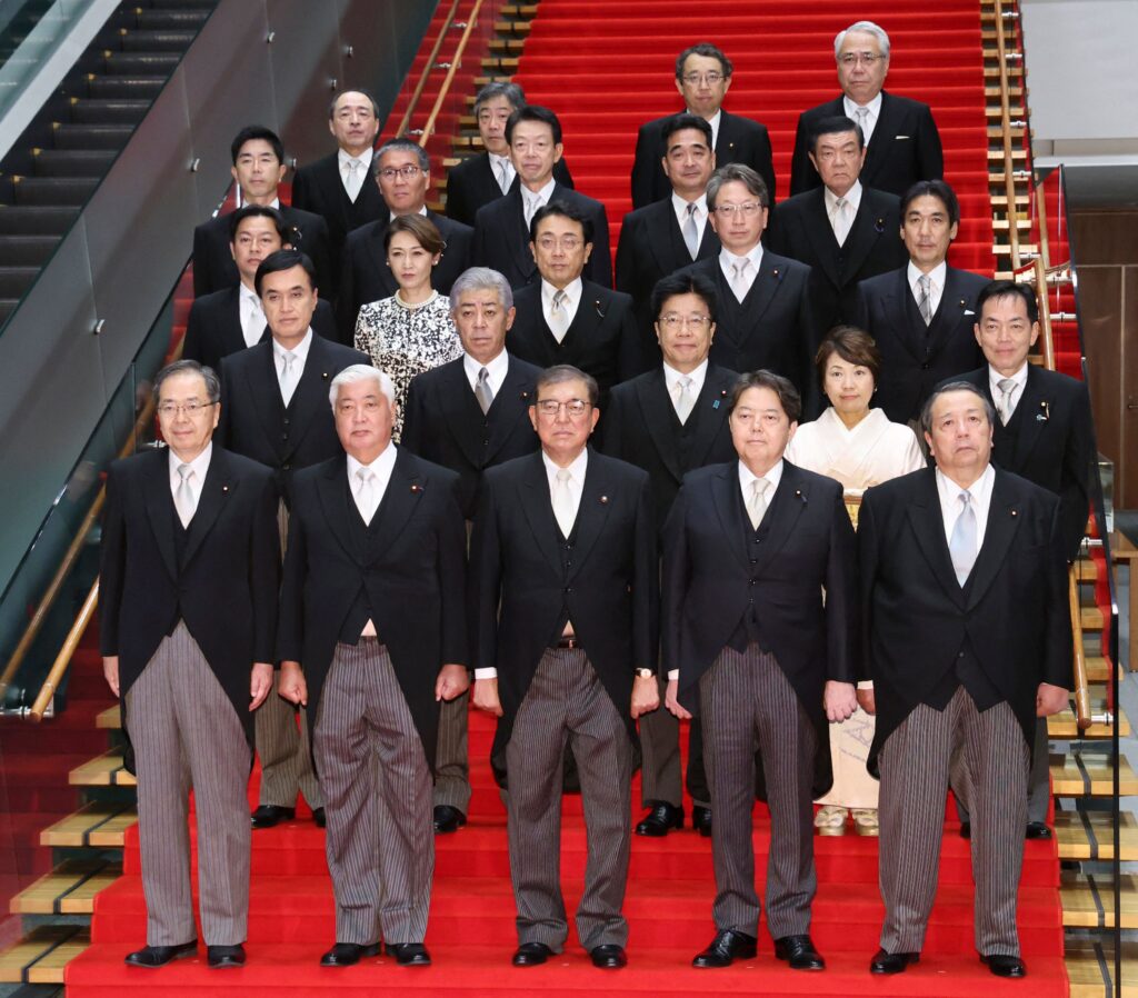 This picture taken on October 1, 2024 shows Japan's new Prime Minister ISHIBA Shigeru (front C) posing during a photo session with the members of his cabinet at the prime minister's official residence in Tokyo. (AFP)