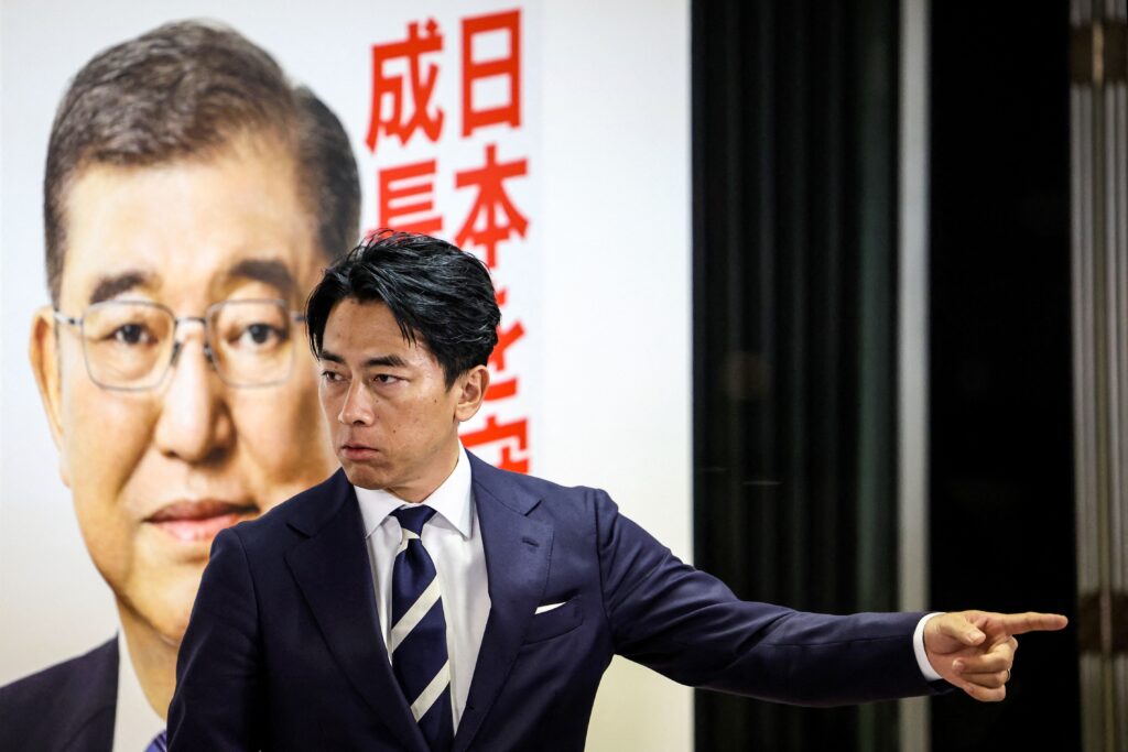 Japan's former Environment Minister KOIZUMI Shinjiro leaves after a press conference at the Liberal Democratic Party (LDP) headquarters in Tokyo on October 27, 2024, during the country's general election. (AFP)