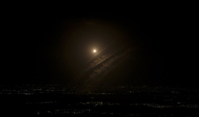 This picture taken from the West Bank city of Hebron shows a projectile above the Israeli city of Ashdod, on October 1, 2024. (AFP)