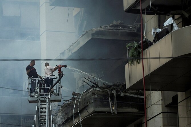 Rescuers work at a site of an Israeli strike, amid ongoing cross-border hostilities between Hezbollah and Israeli forces, in south Beirut, Lebanon. (Reuters)