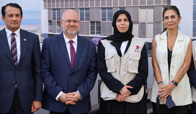 Qatari Minister of State for International Cooperation at the Ministry Of Foreign Affairs, Lolwah Bint Rashid Al Khater and Lebanese Minister of Public Health Firass Abiad pose for a picture, amid ongoing hostilities between Hezbollah and Israeli forces, outside of Beirut Governmental Hospital in Beirut's Karantina district, Lebanon, October 8, 2024. (REUTERS)