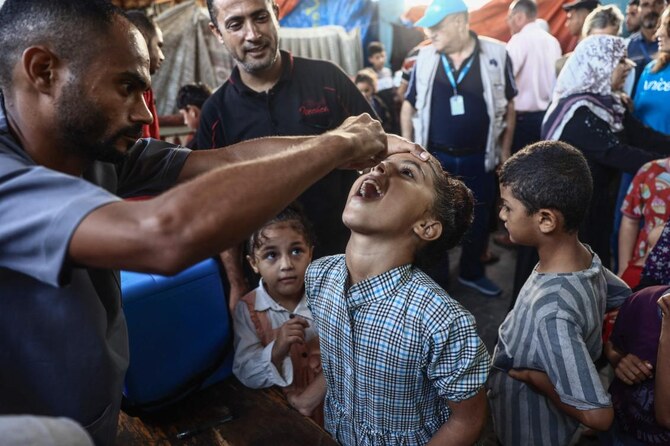 Palestinian children receive drops as part of a polio vaccination campaign, in Deir al-Balah in the central Gaza Strip amid the ongoing war between Israel and Hamas. (AFP)